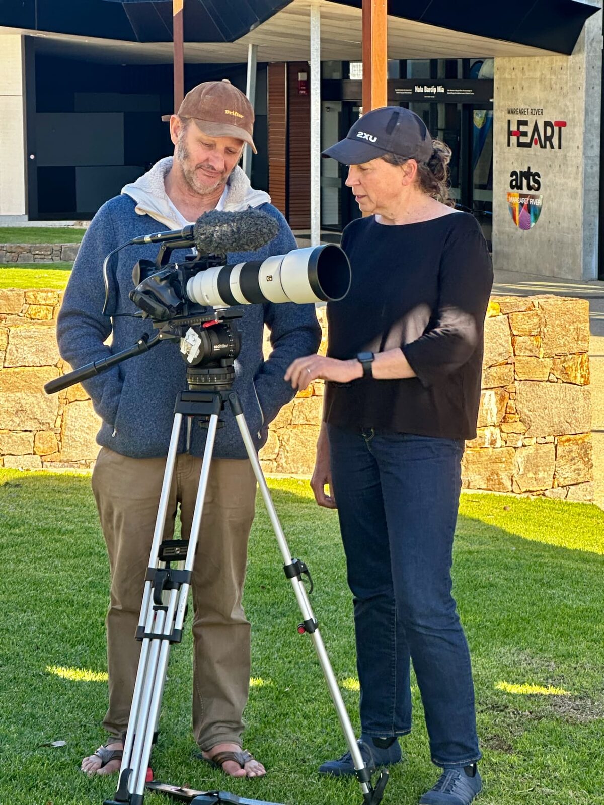 Festival directors Jane Hammond and Richard Todd with a film camera outside Margaret River HEART